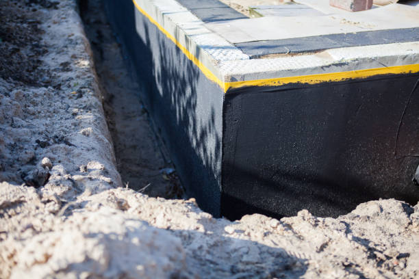 Professional Waterproofing technician working in Lansing, MI